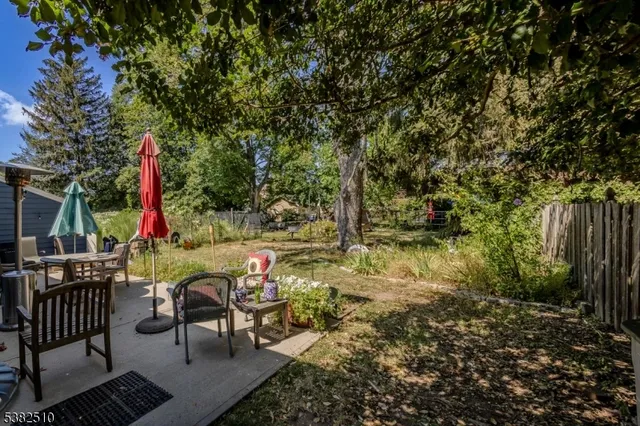 a view of backyard with sitting area and outdoor seating