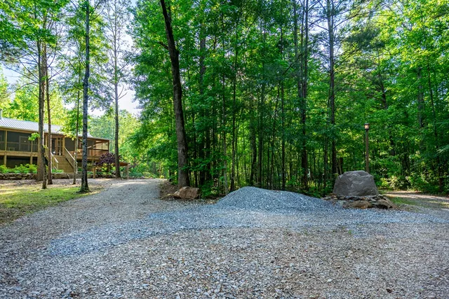 an aerial view of house with yard and outdoor seating