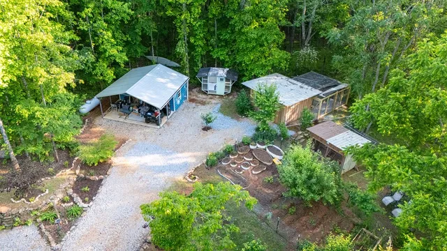 a view of a porch with wooden floor and furniture