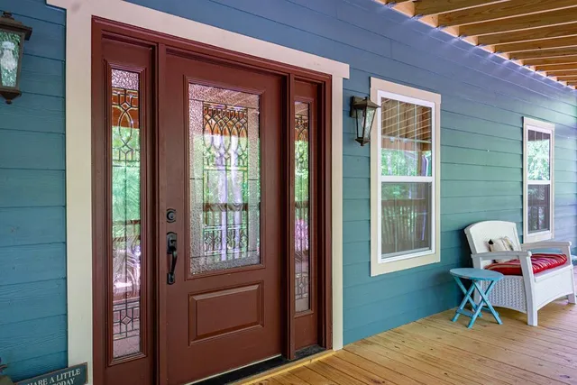 a lobby with furniture and floor to ceiling window