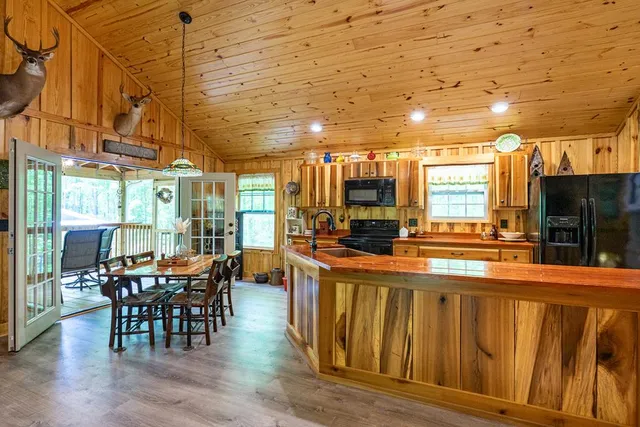 a living room with furniture a rug and a window