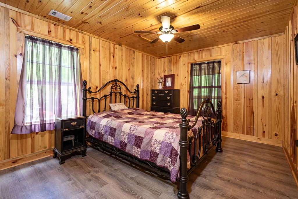 153 North Whatley Road LaGrange, GA 30240 - Photo 31 of 67 a bedroom with a bed a window and a chandelier