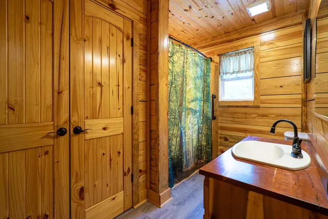 a living room with stainless steel appliances kitchen island granite countertop furniture and a kitchen view