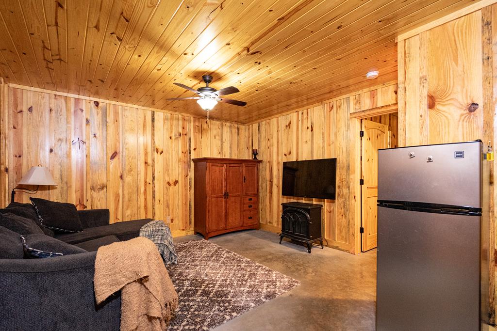 153 North Whatley Road LaGrange, GA 30240 - Photo 35 of 67 a living room with furniture a refrigerator and a flat screen tv
