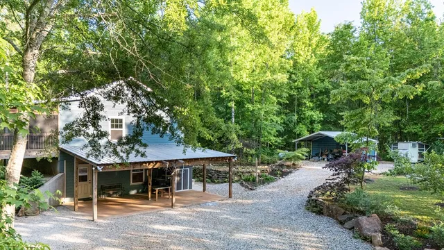 a view of outdoor space with deck and trees