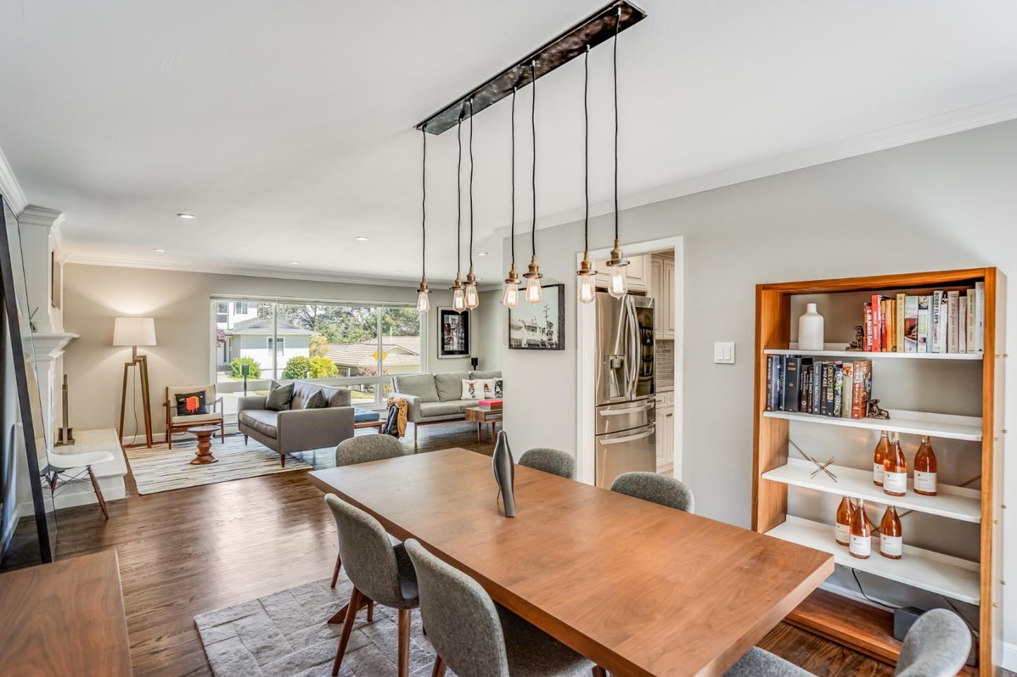 775 Pico Avenue San Mateo, CA 94403 - Photo 18 of 66 a living room with furniture a bookshelf and a large window
