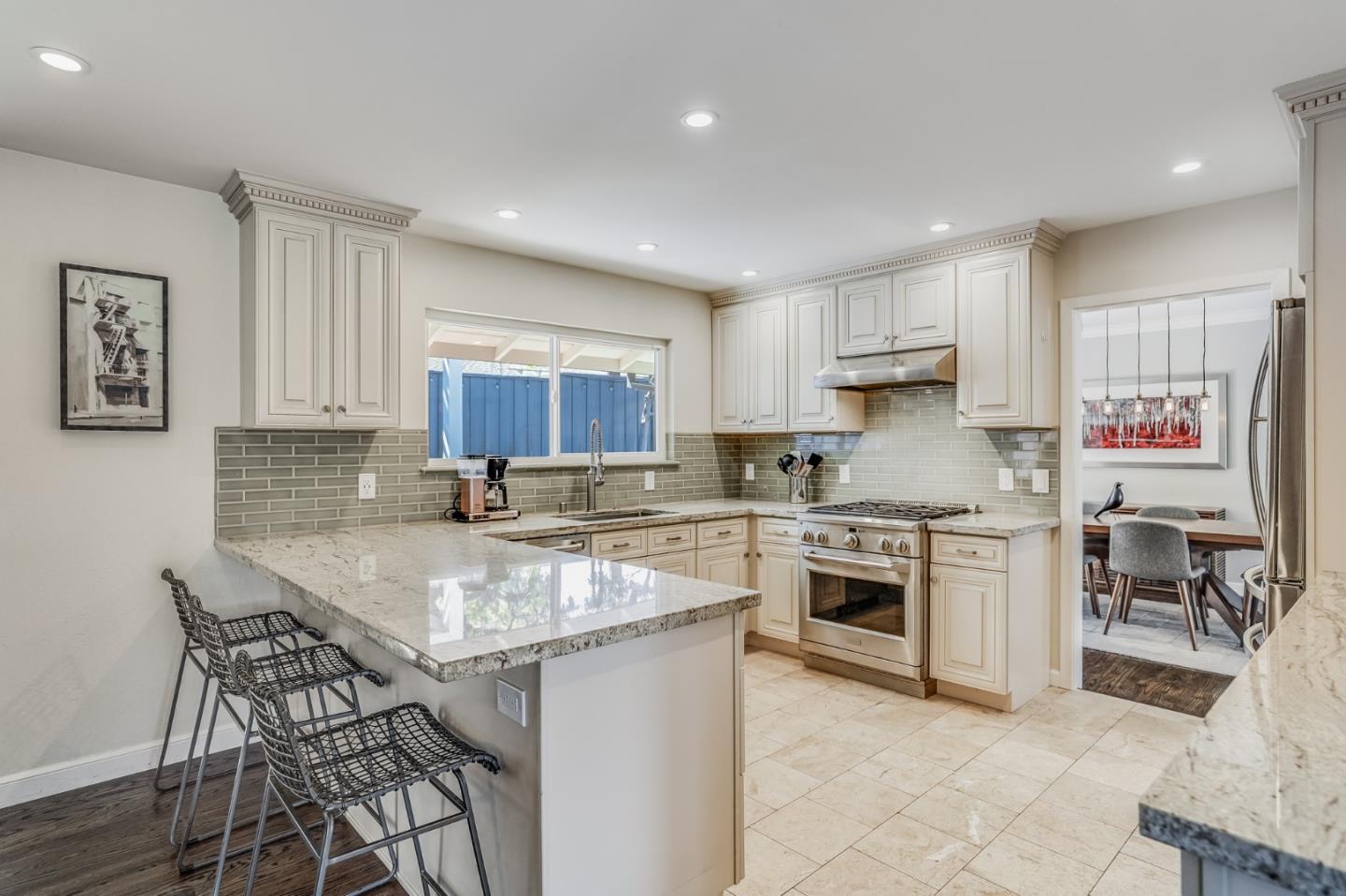 775 Pico Avenue San Mateo, CA 94403 - Photo 20 of 66 a kitchen with a table chairs stove and cabinets