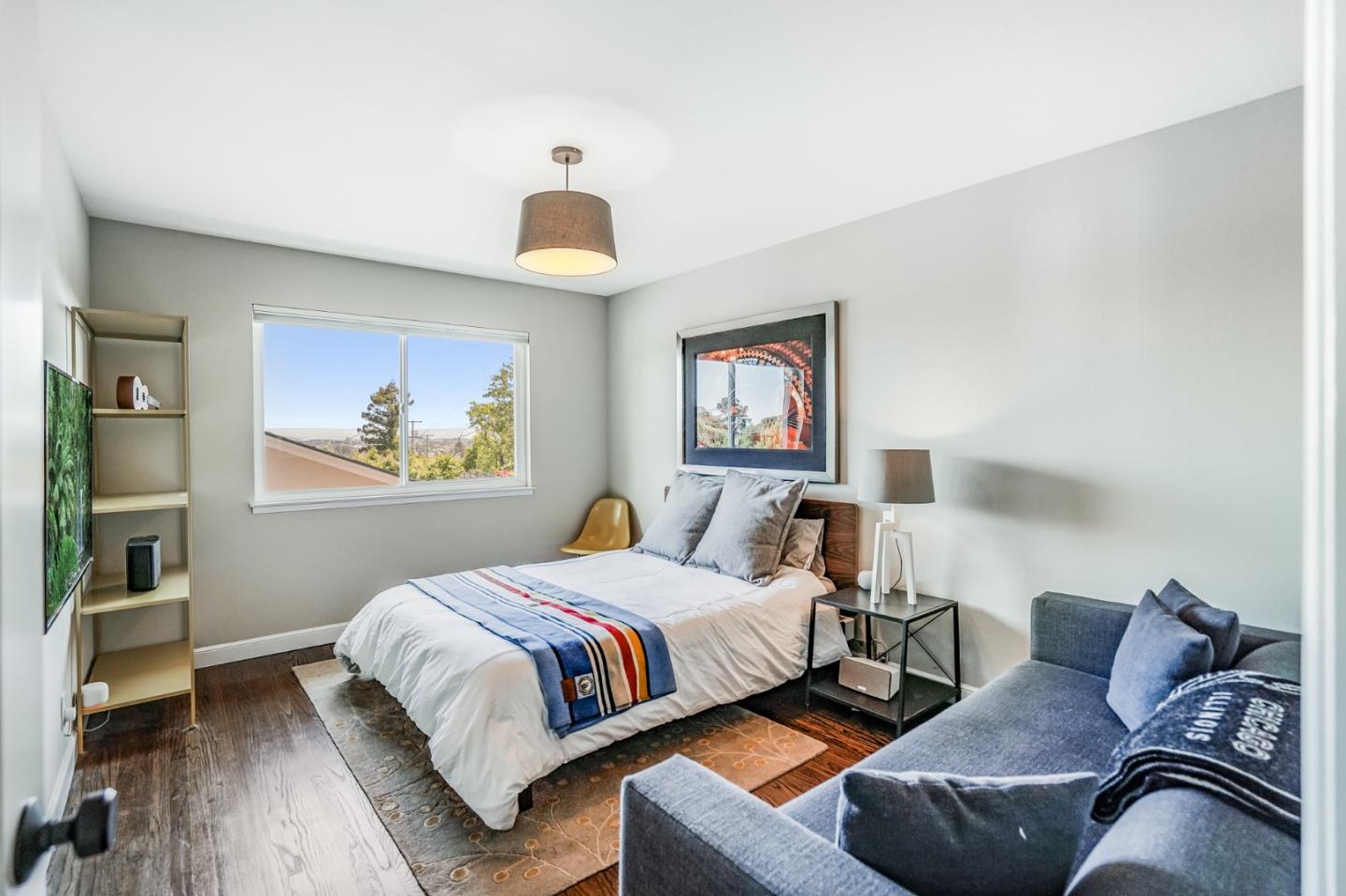 775 Pico Avenue San Mateo, CA 94403 - Photo 33 of 66 a bedroom with a bed and a painting on the wall