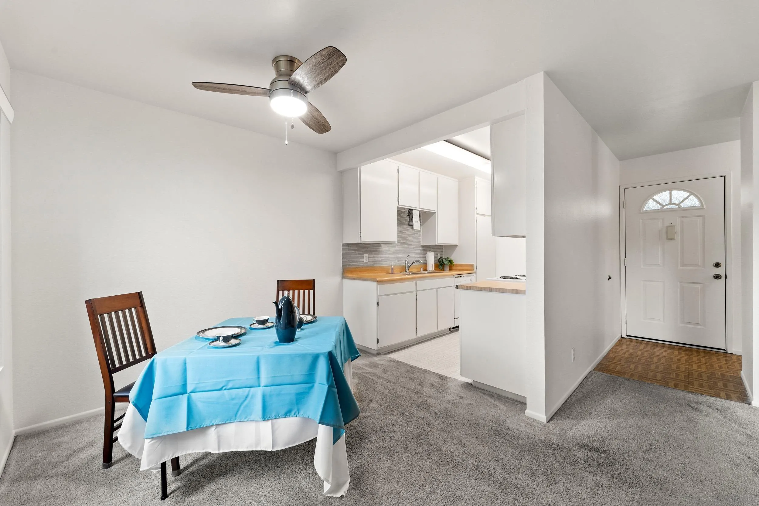 8640 Via Mallorca, Unit A La Jolla, CA 92037 - Photo 13 of 24 a room with a chair and white cabinets