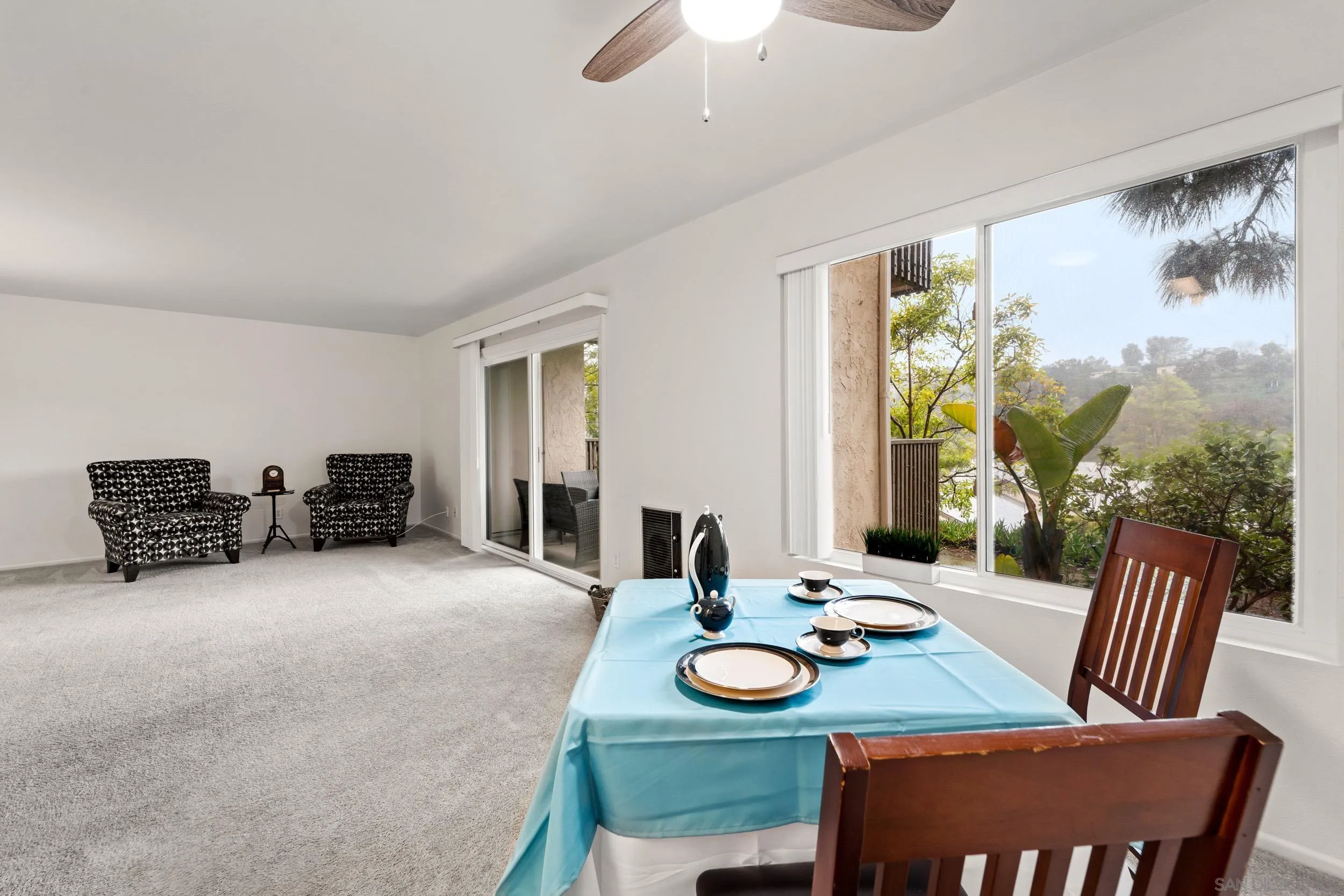 8640 Via Mallorca, Unit A La Jolla, CA 92037 - Photo 14 of 24 a view of a dining room with furniture window and outside view