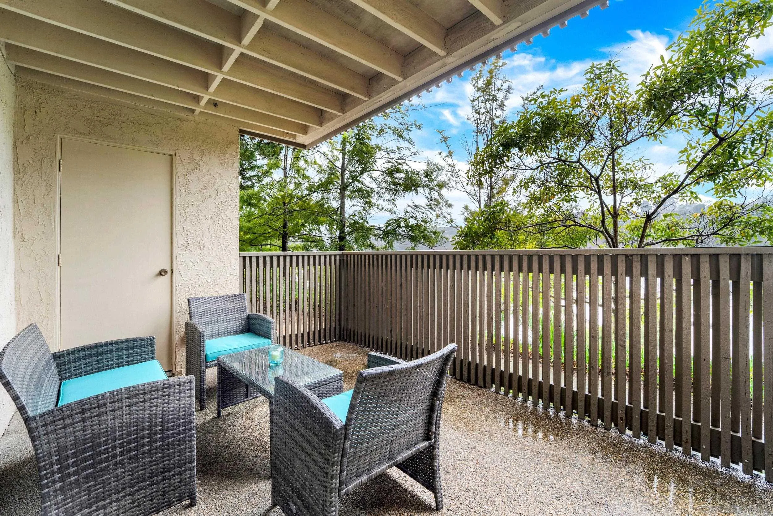 8640 Via Mallorca, Unit A La Jolla, CA 92037 - Photo 20 of 24 a view of a chair and table in the patio