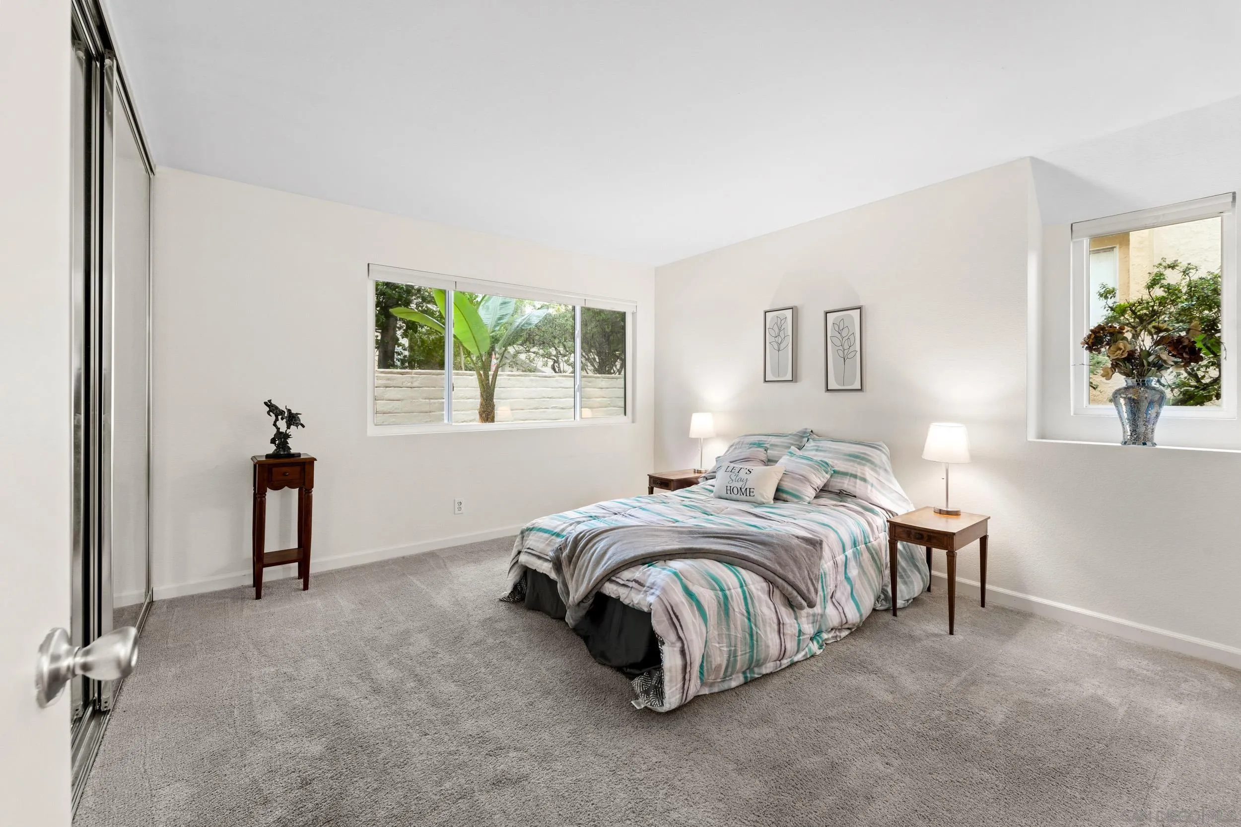 8640 Via Mallorca, Unit A La Jolla, CA 92037 - Photo 6 of 24 a spacious bedroom with a bed and a window