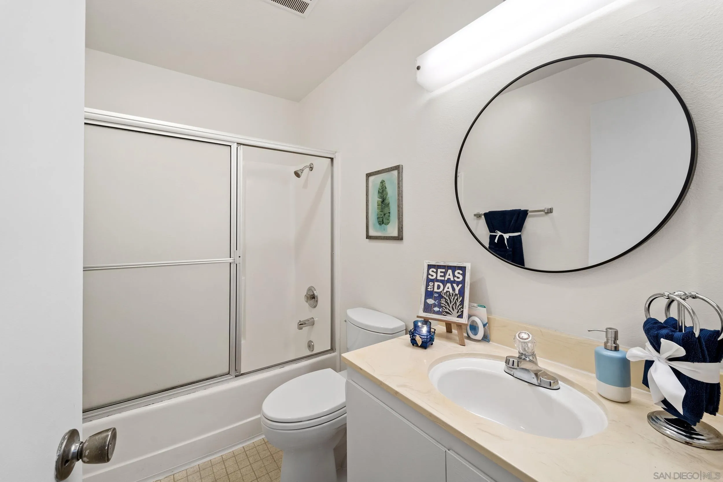 8640 Via Mallorca, Unit A La Jolla, CA 92037 - Photo 7 of 24 a bathroom with a sink and a mirror