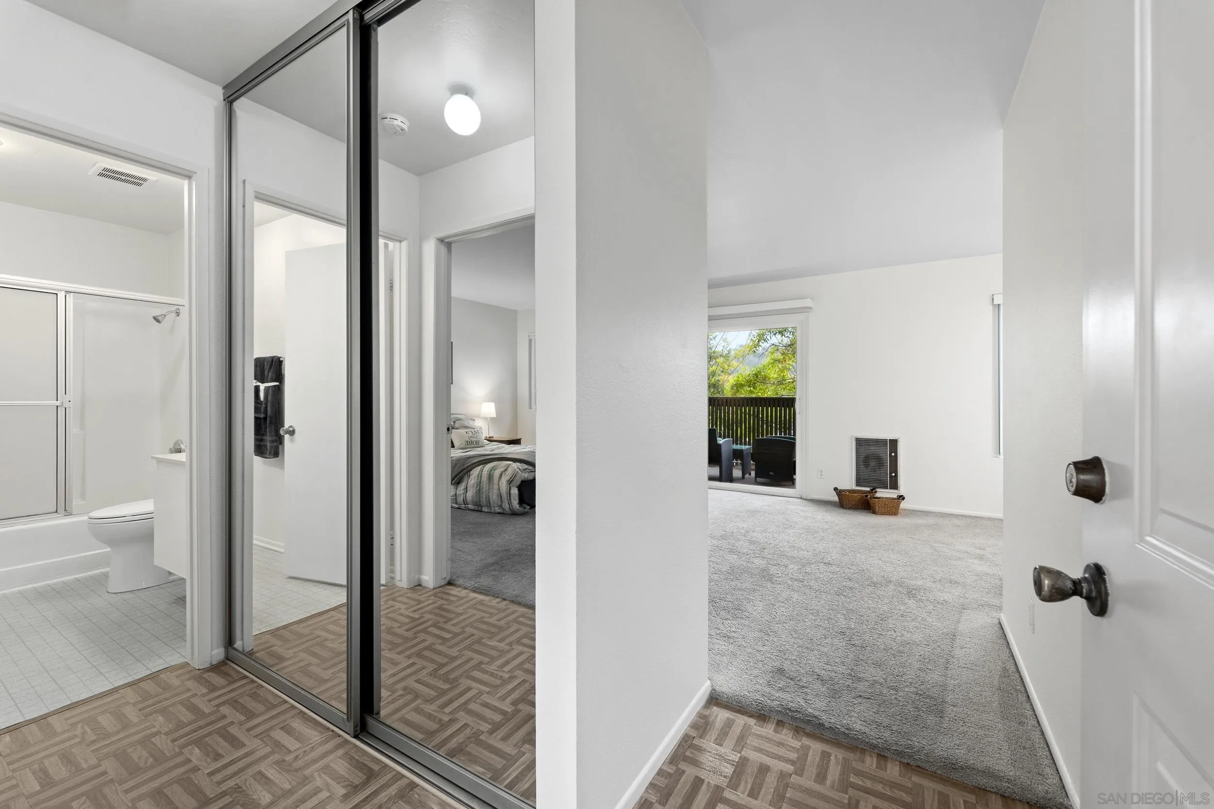 8640 Via Mallorca, Unit A La Jolla, CA 92037 - Photo 8 of 24 a bathroom with a glass shower door and a window