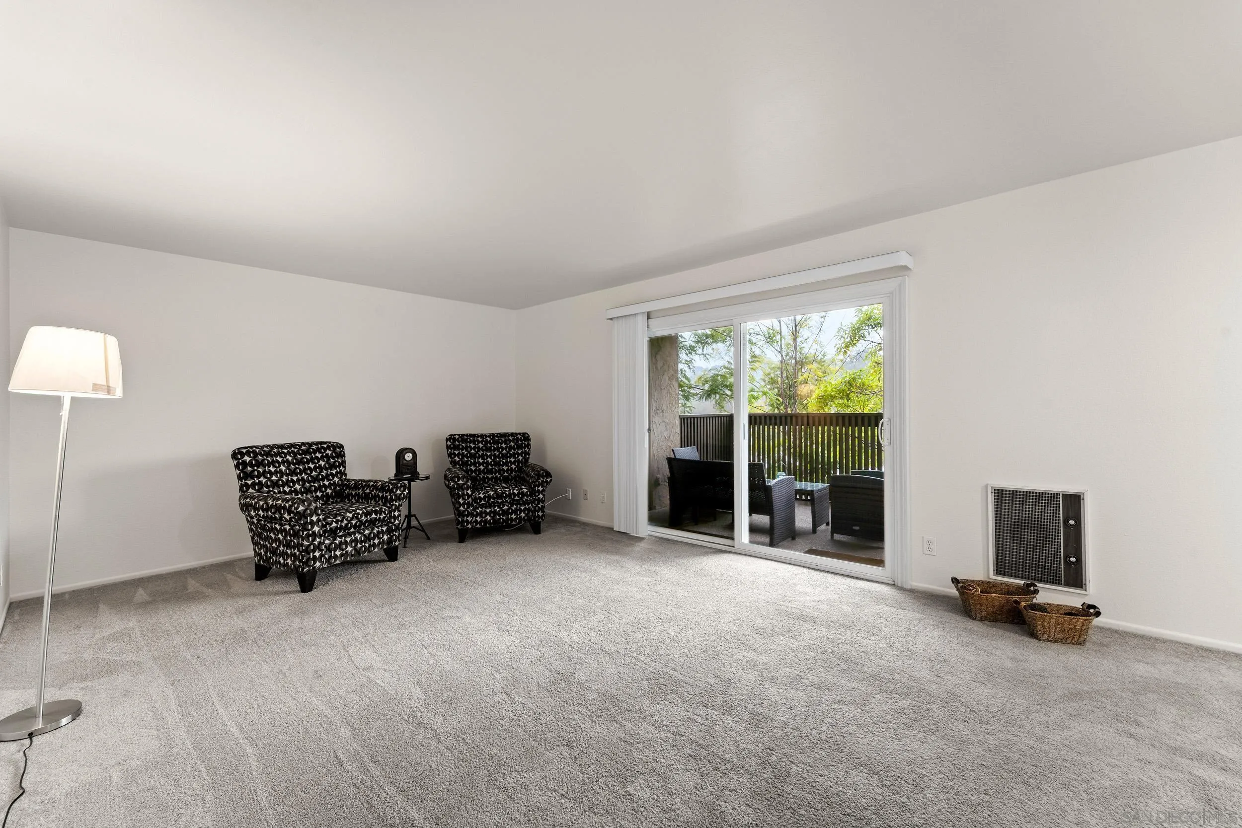 8640 Via Mallorca, Unit A La Jolla, CA 92037 - Photo 9 of 24 a room with furniture and a flat screen tv