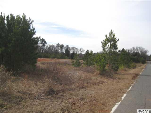0 Helms Road Lancaster, SC 29720 - Photo 3 of 9 a view of a dry yard with trees