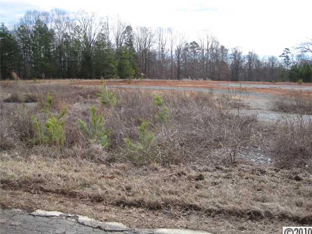 0 Helms Road Lancaster, SC 29720 - Photo 5 of 9 a view of dirt field with trees in background