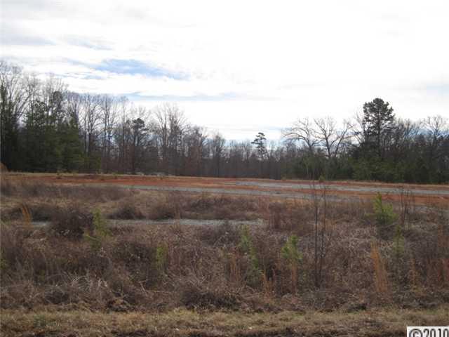 0 Helms Road Lancaster, SC 29720 - Photo 6 of 9 a view of a field with trees in background
