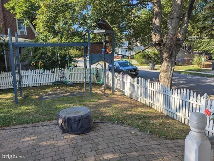 a view of a dining room with furniture wooden floor and a chandelier