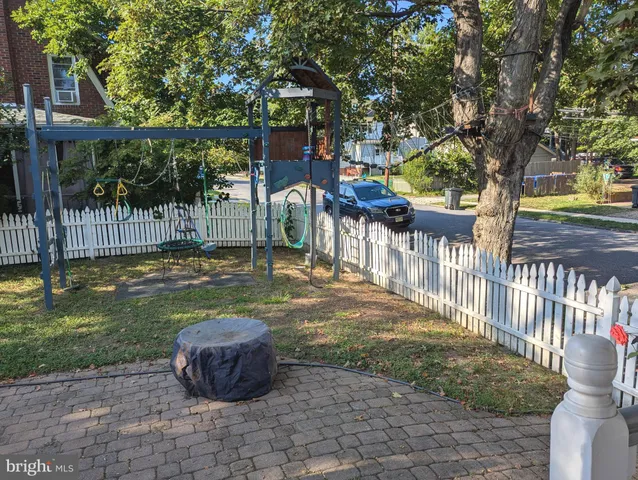 a view of a dining room with furniture wooden floor and a chandelier