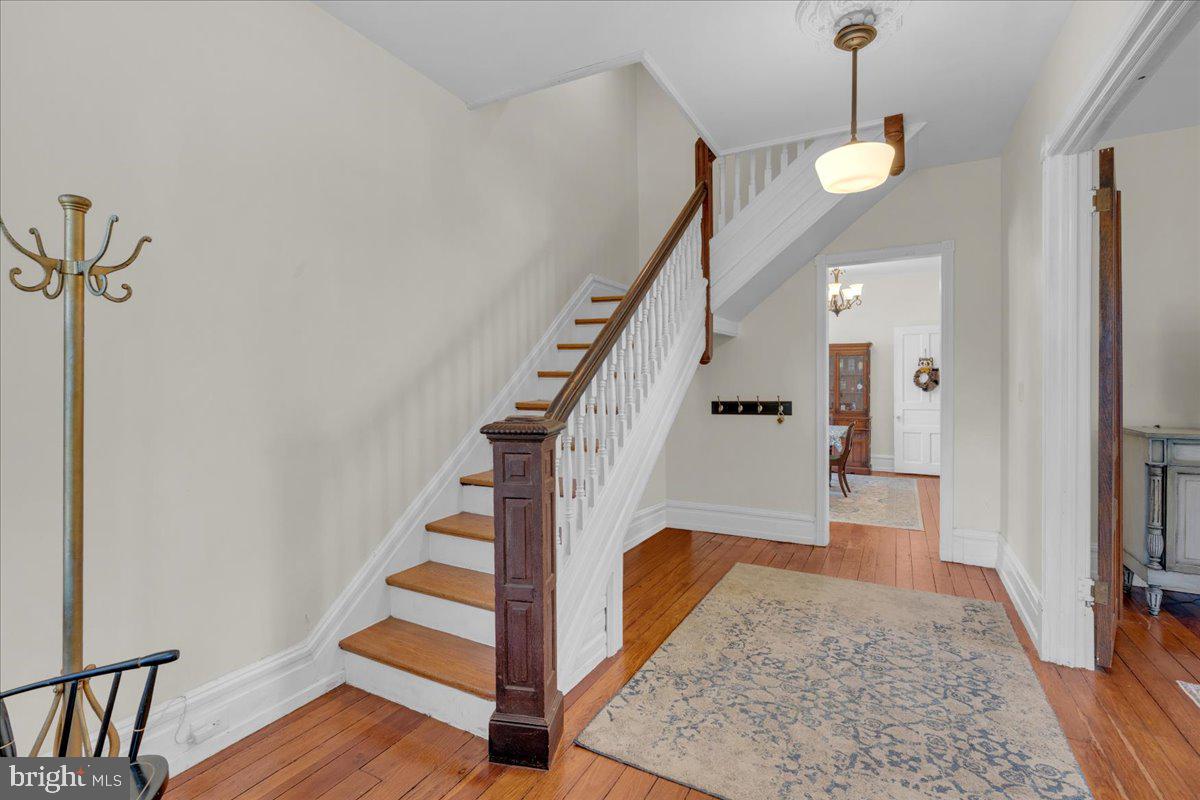 45 Broad Street Mount Holly, NJ 08060 - Photo 16 of 58 a view of entryway and hall with wooden floor