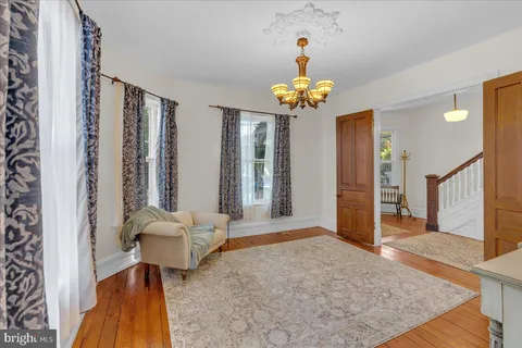 a kitchen with stainless steel appliances granite countertop white cabinets and a sink