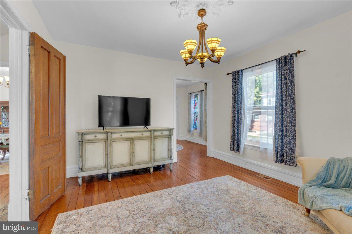45 Broad Street Mount Holly, NJ 08060 - Photo 20 of 58 a living room with furniture and a flat screen tv