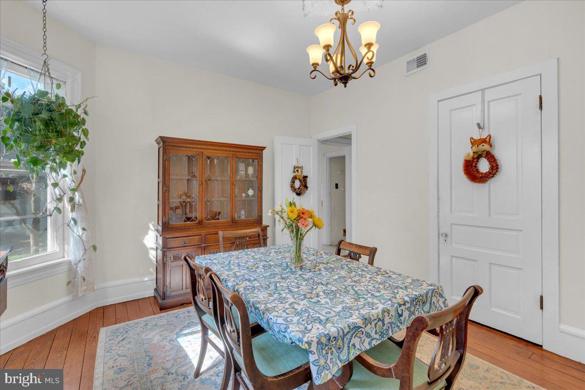 45 Broad Street Mount Holly, NJ 08060 - Photo 24 of 58 a dining room filled chandelier and wooden floor