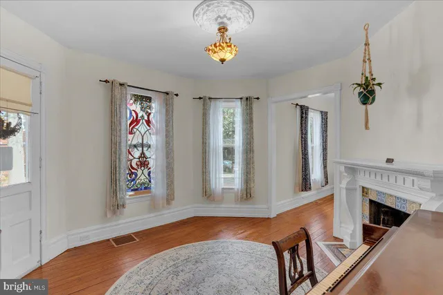 a room with a bed and a mirror