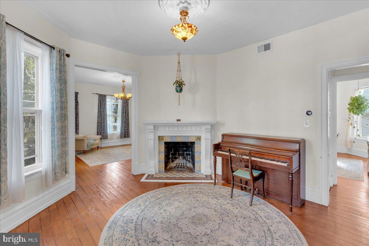 45 Broad Street Mount Holly, NJ 08060 - Photo 31 of 58 a living room with furniture and a fireplace