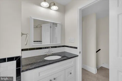 an empty room with windows and entrance