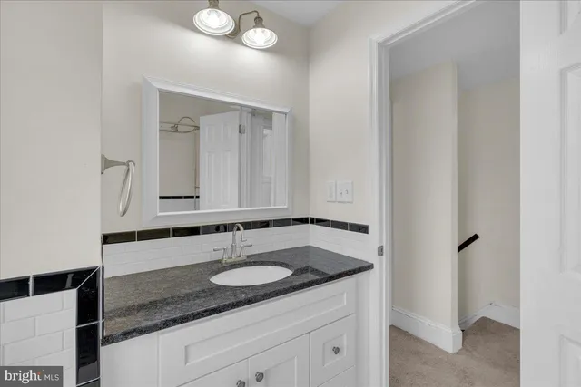 an empty room with windows and entrance