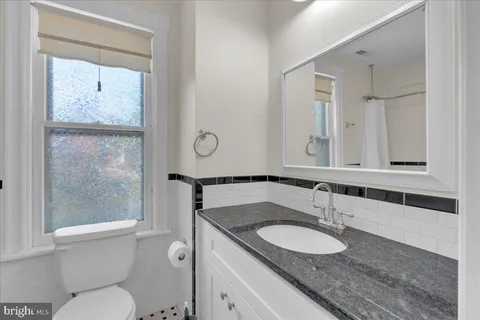 a view of wooden deck with chair and table