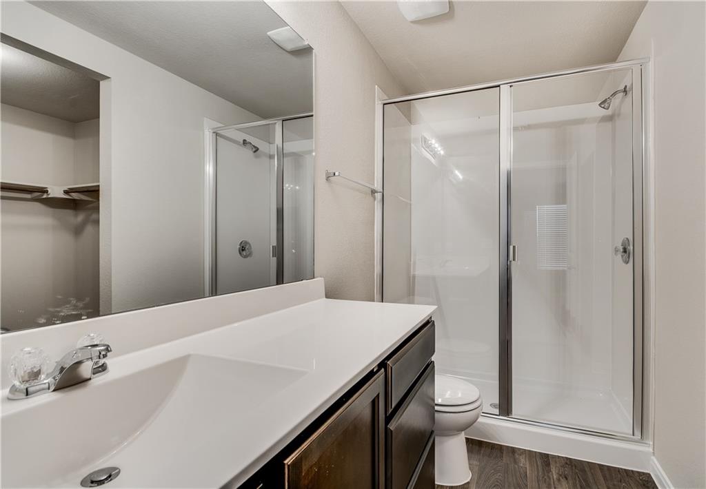 185 Voss Kyle, TX 78640 - Photo 15 of 26 a bathroom with a sink a toilet and shower