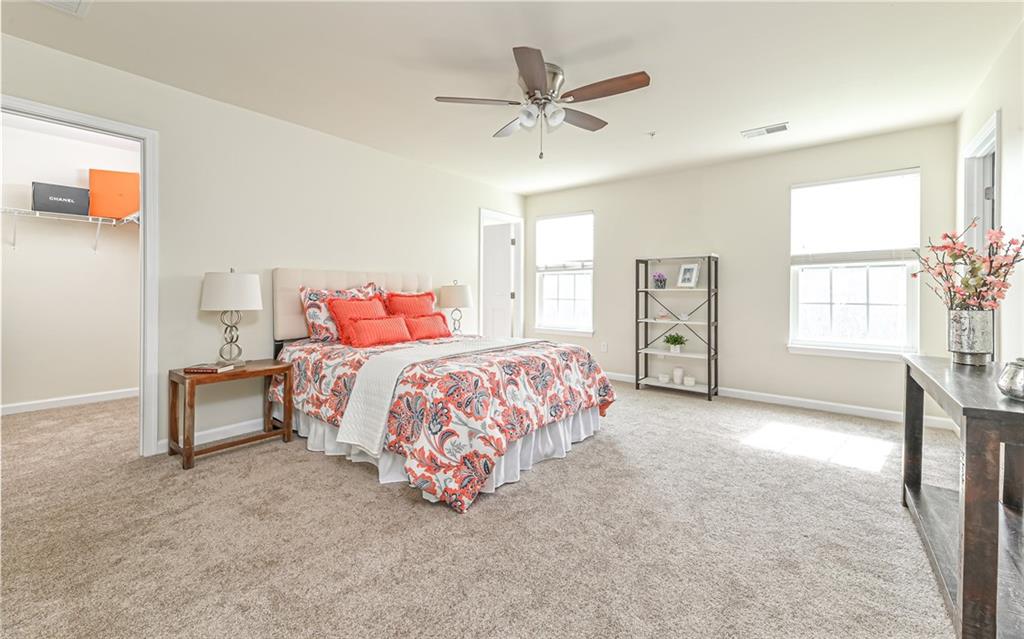 205 Broadstone Drive Mars, PA 16046 - Photo 12 of 24 a spacious bedroom with a bed and a chandelier