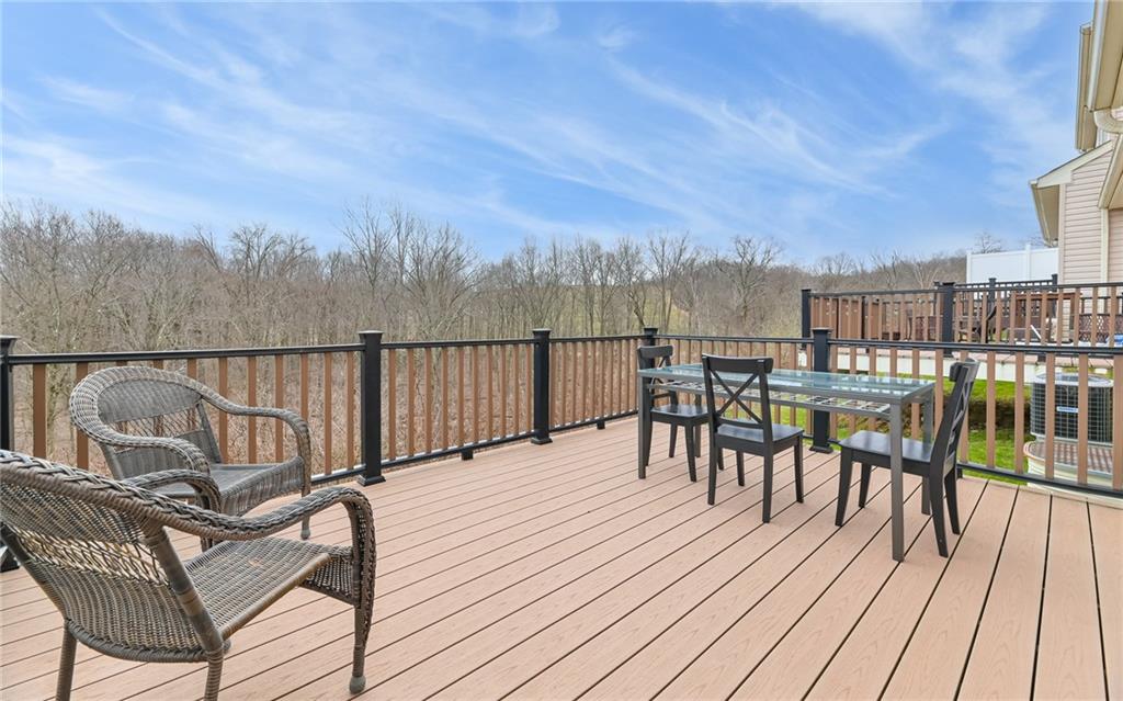 205 Broadstone Drive Mars, PA 16046 - Photo 22 of 24 a view of a roof deck with table and chairs