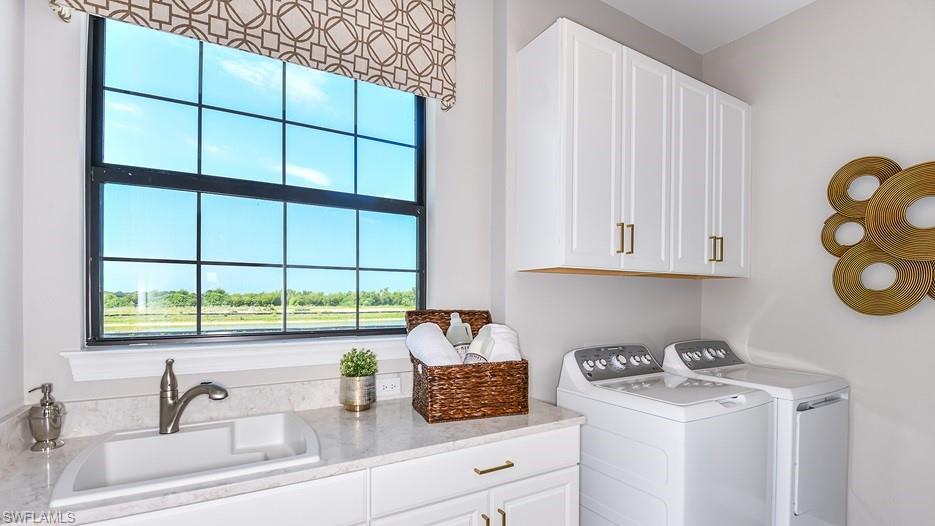 15335 Lucerna Street, Unit 201 Naples, FL 34114 - Photo 8 of 11 a kitchen with a sink cabinets and a window