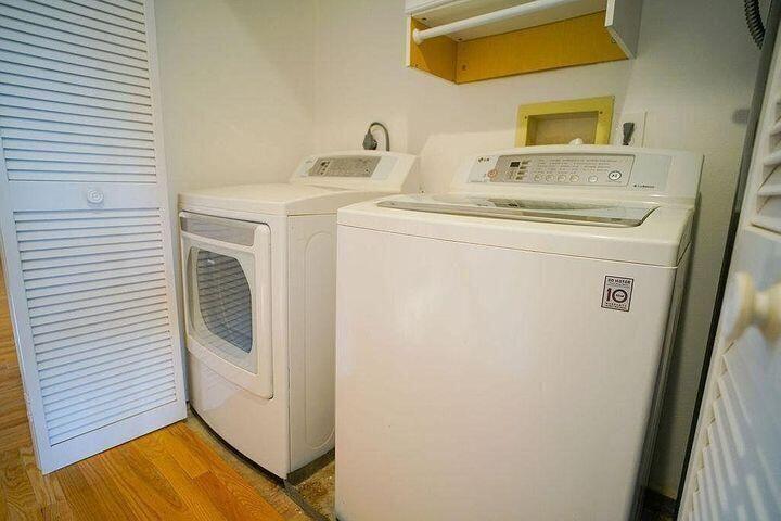 1511 Ocean Dunes Circle, Unit 1511 Jupiter, FL 33477 - Photo 13 of 27 a utility room with dryer and washer