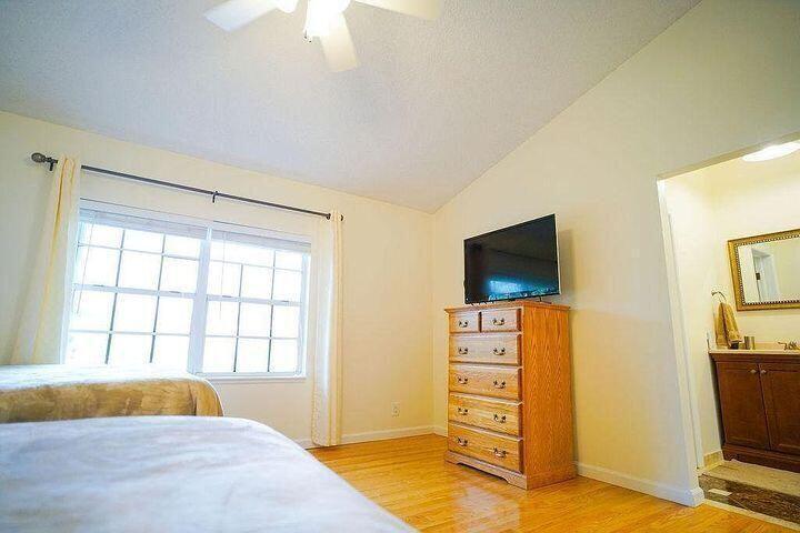 1511 Ocean Dunes Circle, Unit 1511 Jupiter, FL 33477 - Photo 14 of 27 a bedroom with a bed and flat screen tv