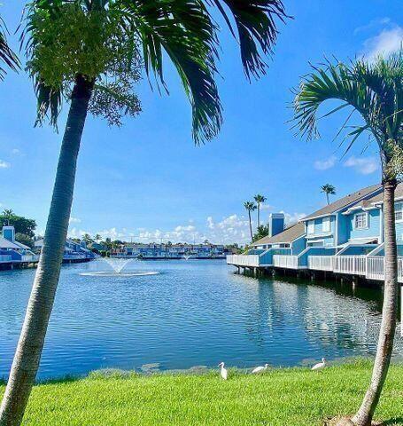 1511 Ocean Dunes Circle, Unit 1511 Jupiter, FL 33477 - Photo 7 of 27 a view of a lake with houses