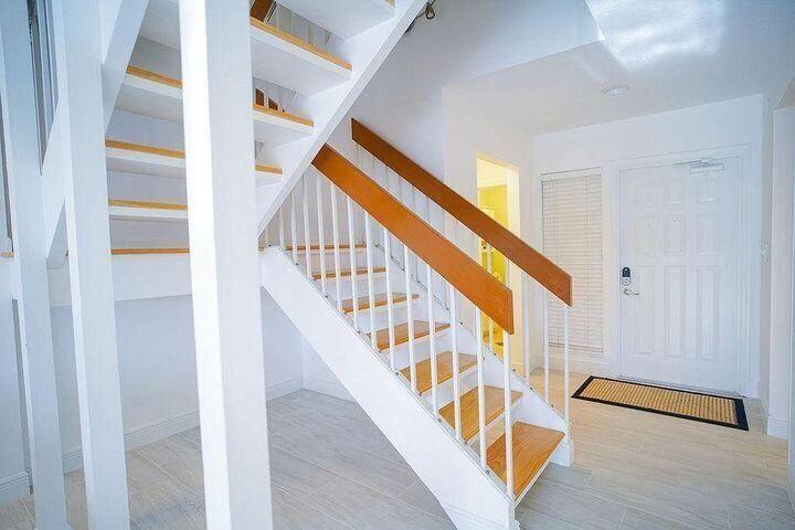 1511 Ocean Dunes Circle, Unit 1511 Jupiter, FL 33477 - Photo 9 of 27 a view of an entryway with wooden floor
