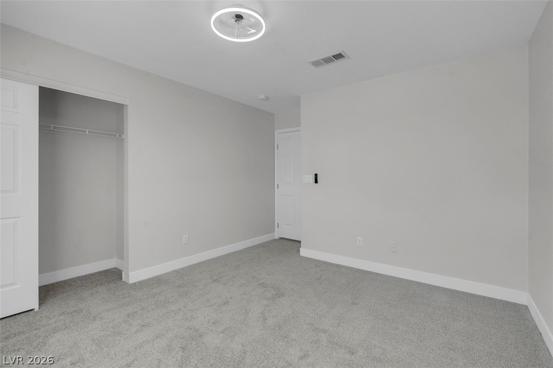 3604 North Campbell Road Las Vegas, NV 89129 - Photo 45 of 54 Unfurnished bedroom with carpet floors, baseboards, and a closet