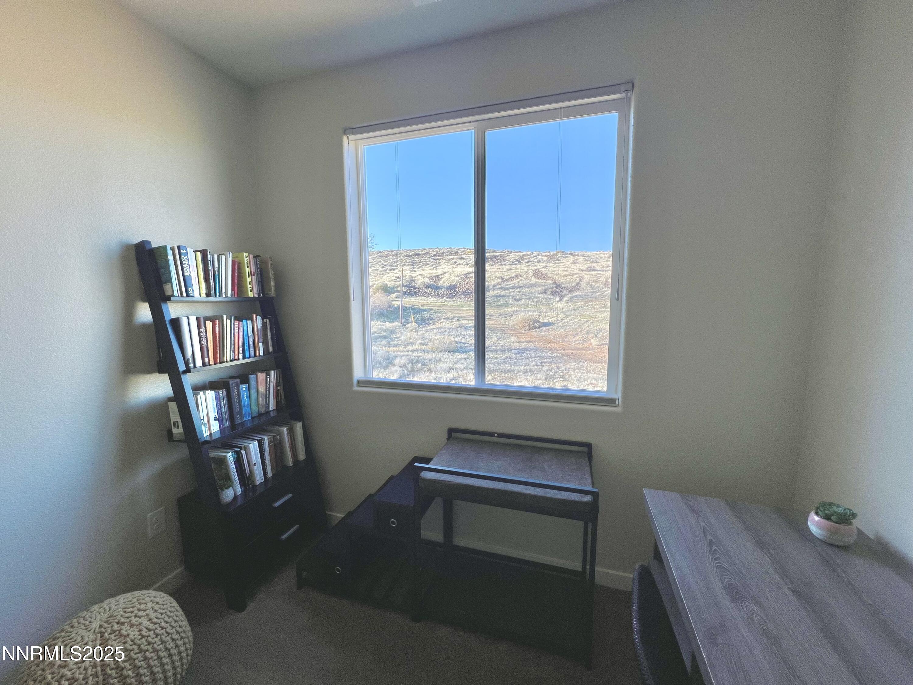 4969 Cavestone Road Sun Valley, NV 89433 - Photo 21 of 40 a reading room with furniture and a window