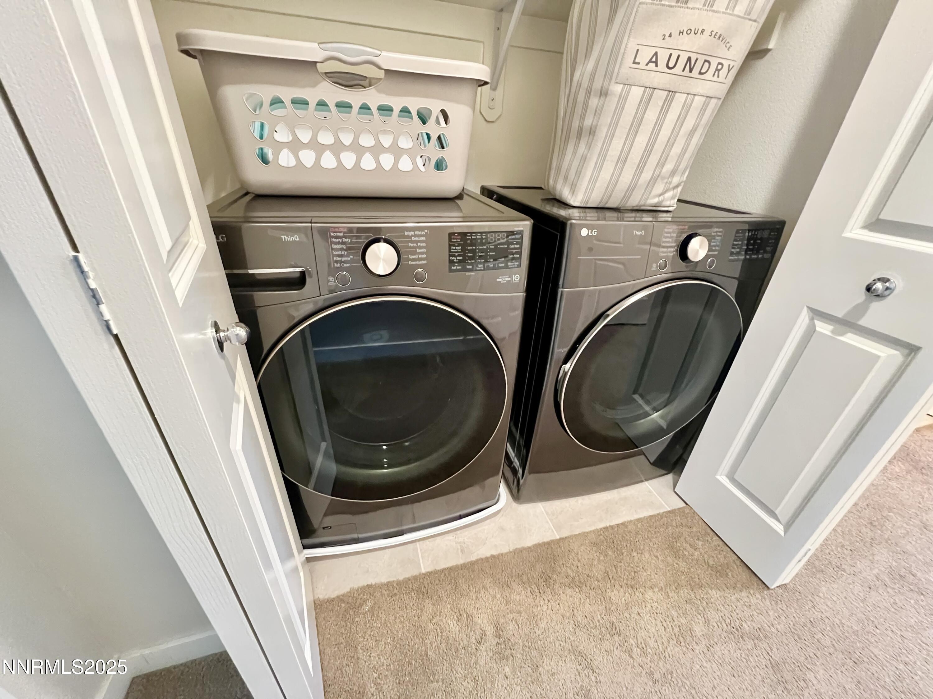 4969 Cavestone Road Sun Valley, NV 89433 - Photo 27 of 40 a utility room with dryer and washer