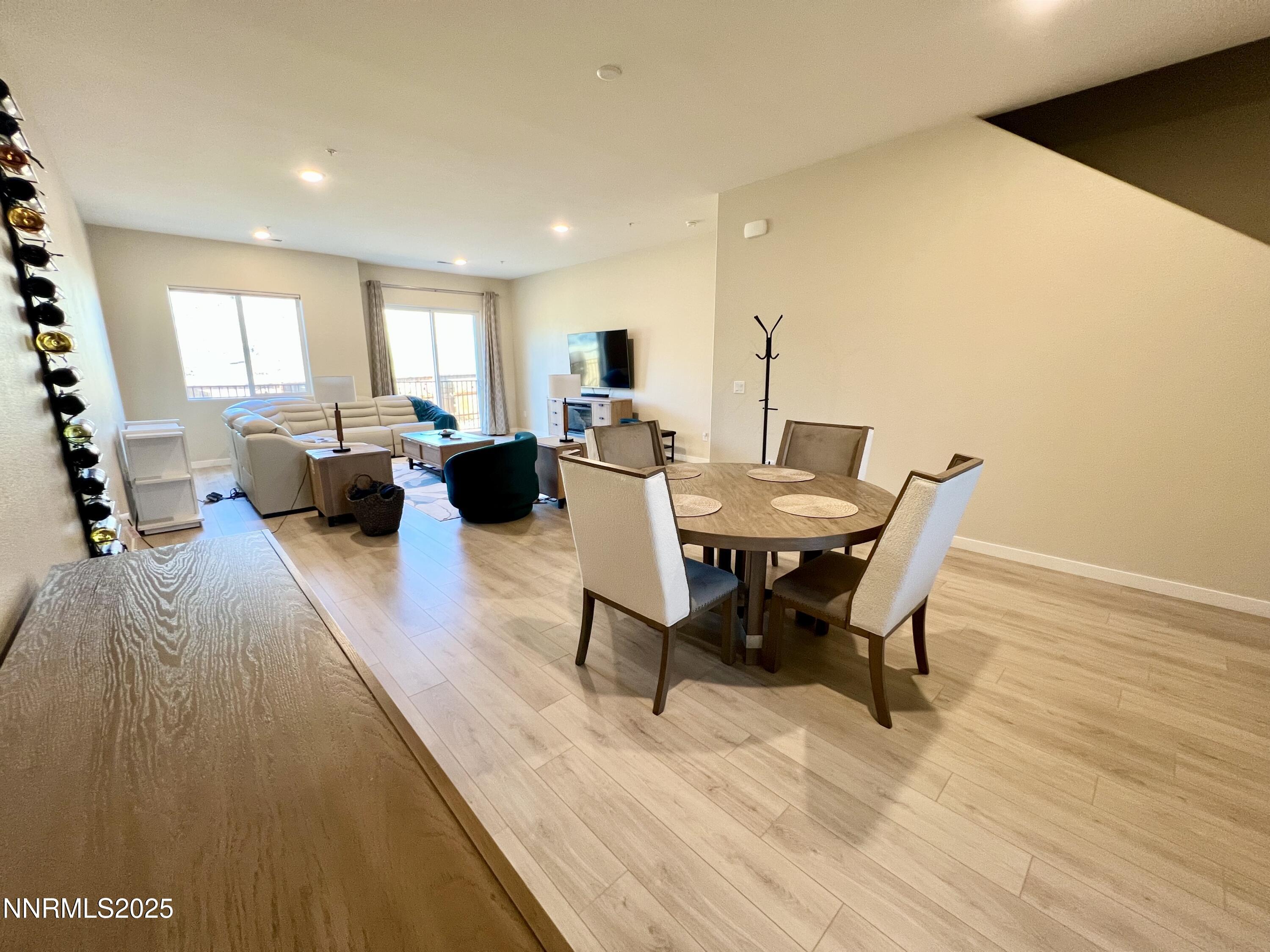 4969 Cavestone Road Sun Valley, NV 89433 - Photo 7 of 40 a view of a dining room with furniture