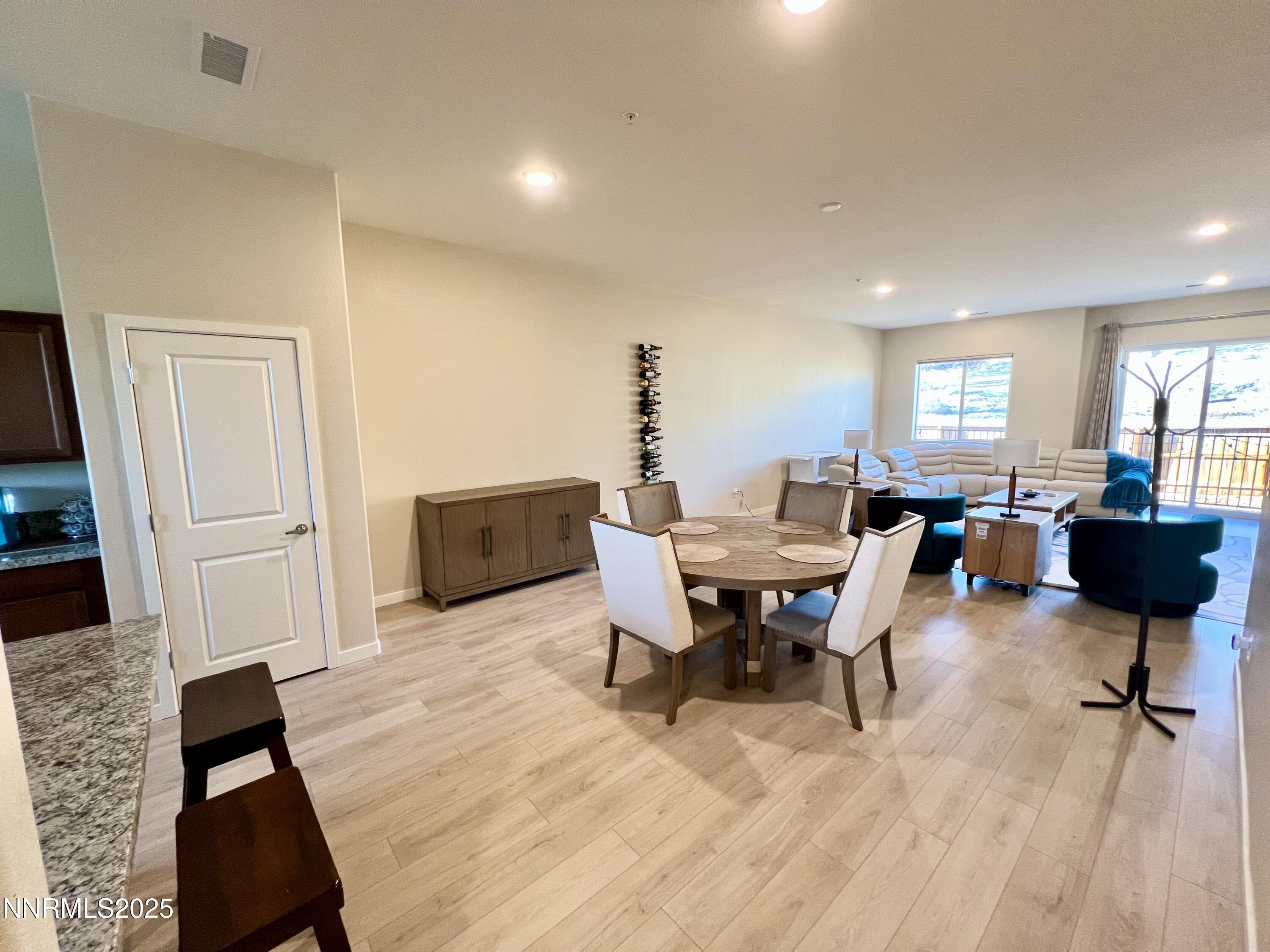 4969 Cavestone Road Sun Valley, NV 89433 - Photo 9 of 40 a view of a livingroom with furniture and a flat screen tv