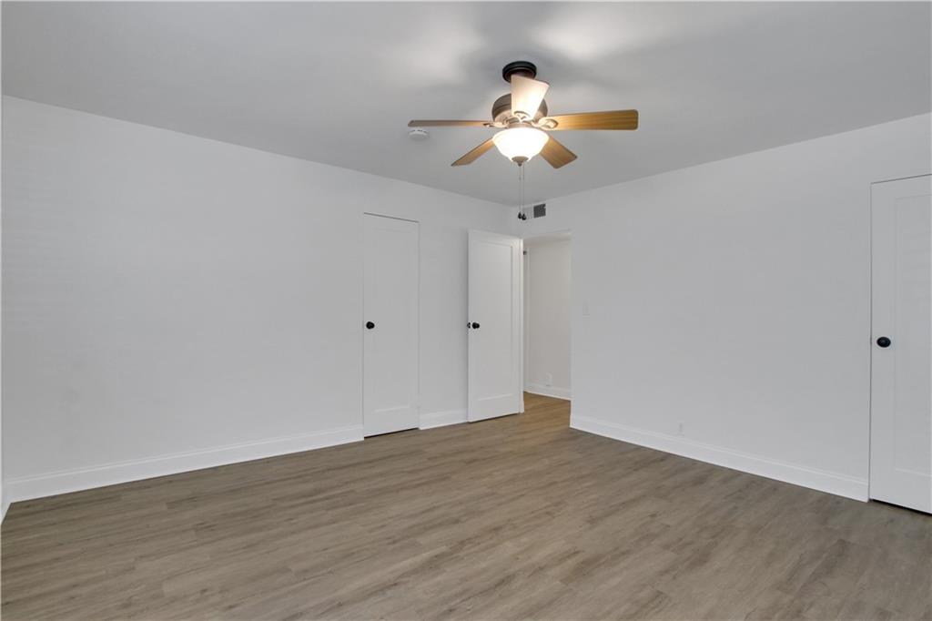 1174 Briarcliff Road Northeast, Unit 1 Atlanta, GA 30306 - Photo 16 of 24 a view of an empty room with wooden floor