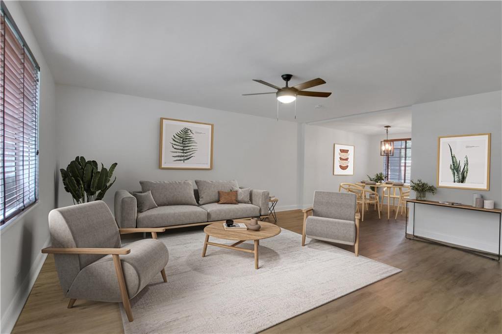 1174 Briarcliff Road Northeast, Unit 1 Atlanta, GA 30306 - Photo 6 of 24 a living room with furniture and a large window