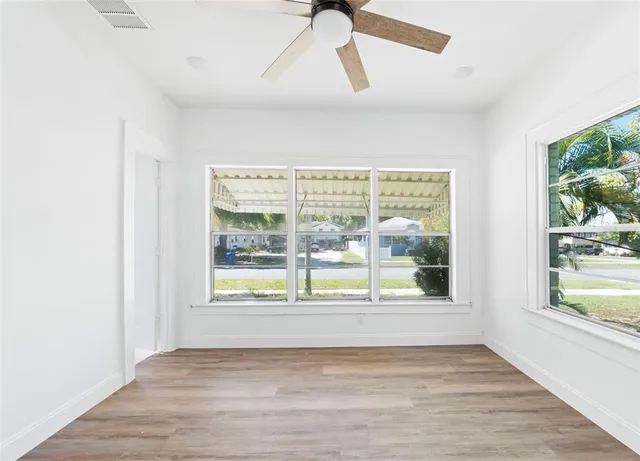 a view of an empty room with a window