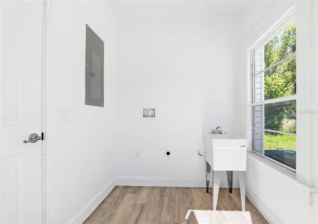 a bathroom with a sink toilet and a mirror